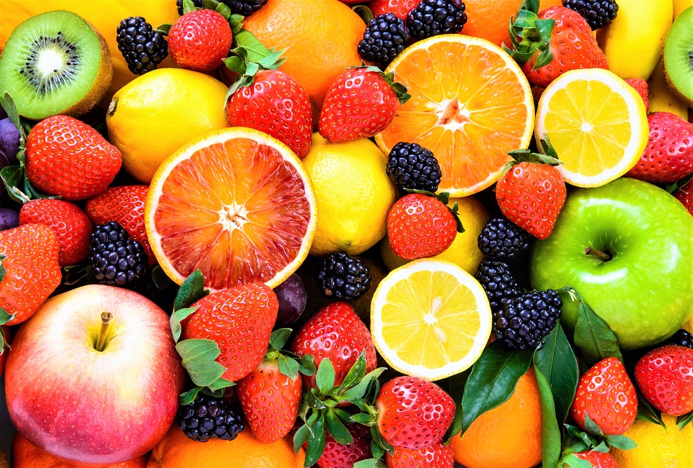 A colorful assortment of super healthy fruits- just one of the many natural foods that make you lose weight