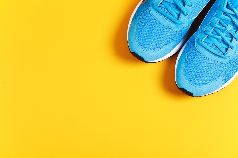 Blue shoes on a yellow background- 7 day weight loss challenge exercise session