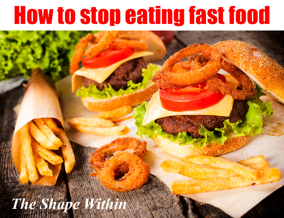 Onion rings and a fast food meal sitting on a wooden table- How to stop eating fast food and start eating more healthy foods